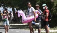Julien Le Guet (C), spokesman for the 'Bassines Non Merci' (Reservoirs, No Thanks) movement, stands in a buoy featuring a unicorn, asking French Gendarmerie officers, not to charge during a protest against the construction of giant water reservoirs (Mega-bassines) in La Rochelle, western France on July 20, 2024. (Photo by Philippe Lopez / AFP)
