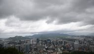 A general view shows the city skyline after heavy rain as seen from the landmark Namsan Tower in central Seoul on July 17, 2024. (Photo by Jung Yeon-je / AFP)