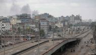 Smoke bellows from the backside of Dhaka's southern outskirt neighbourhood as clash erupts between police and anti-quota protesters in Dhaka, Bangladesh, July 21, 2024. (Photo by Anik Rahman / AFP)
