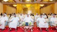 Minister of Environment and Climate Change H E Dr. Abdullah bin Abdulaziz bin Turki Al Subaie (centre) and other officials attending an honouring ceremony for participants of the first edition of the 2024 Summer Environmental Club programme yesterday.  
