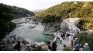 Local residents and environmentalists take part in a protest against the construction of a water pipeline, at Brataj old bridge over Shushica river, in the village of Brataj, near Albanian city of Vlore, some 200 km South of capital Tirana, on July 12, 2024. Photo by ADNAN BECI / AFP