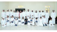 Students with officials at closing ceremony of summer course programme for students of Al Noor Arabic And Quran Learning Center.