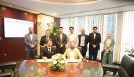 Officials from Aamal Company and its subsidiary during the signing of strategic partnership.