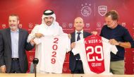 From left: Al Bidda SC's Managing Director Ghassan Oueijan, Al Bidda SC Vice Chairman Sheikh Hamad bin Mohamed bin Fahad Al Thani, Ajax Technical Director Alex Kroes, and Ajax A1 Assistant Manager and Former Netherlands star Ronald de Boer hold Al Bidda club jerseys after announcing the partnership at the Stadium 974, in Doha, yesterday. 