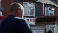 Members of the local community help to clear debris from the streets in Middlesbrough, north east england on August 5, 2024, following rioting and looting the day before. (Photo by Yelim LEE / AFP)
