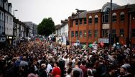 People gather for a counter demonstration against an anti-immigration protest called by far-right activists in the Walthamstow suburb of London on August 7, 2024. Photo by BENJAMIN CREMEL / AFP