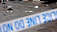 A photograph taken on August 12, 2024 shows a hat and other items in a cordoned off area in Leicester square, London. Photo by BENJAMIN CREMEL / AFP