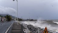 This photograph shows waves crashing against the shoreline in the aftermath of tropical storm Ernesto, in the town of Basse-Terre, on the French Caribbean island of Guadeloupe, on August 13, 2024. (Photo by Brian NOCANDY / AFP)