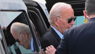 US President Joe Biden exits his motorcade to board Air Force One at Hagerstown Regional Airport in Hagerstown, Maryland, on August 18, 2024. (Photo by ROBERTO SCHMIDT / AFP)
