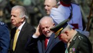 Brazilian President Luiz Inacio Lula da Silva, his Defense Minister Jose Mucio (left) and Brazilian Army Commander General Tomas Miguel Ribeiro attend a ceremony commemorating Soldier's Day at the Army Headquarters in Brasilia on August 22, 2024. (Photo by Sergio Lima / AFP)

