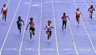 Chinese gold medallist Zhou Xia (centre) during the women's T35 100m final athletics event at the Stade de France in Saint-Denis, north of Paris on August 30, 2024, during the Paris 2024 Paralympic Games. (Photo by Julien De Rosa / AFP)