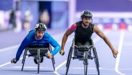 Qatars' Ali Arshad (right) competes in the men’s 100m T34 final during the Paris 2024 Paralympic Games. 