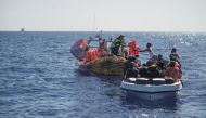 File photo: Crew members of NGO rescue ship 'Ocean Viking' give lifejackets to migrants on an overcrowded boat in the Mediterranean Sea, on October 25, 2022. Camille Martin Juan/Sos Mediterranee/Handout via REUTERS

