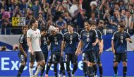 Japan's midfielder Junya Ito (4th L-#14) celebrates with teammates after scoring the team's fifth goal during the third round 2026 World Cup qualifying round football match between Japan and China at Saitama Stadium in Saitama, north of Tokyo, on September 5, 2024. (Photo by Yuichi YAMAZAKI / AFP)
