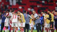 UAE's players celebrate after winning the FIFA World Cup 2026 Asia zone qualifiers football match between Qatar and the United Arab Emirates at the Ahmad Bin Ali Stadium on September 5, 2024. (Photo by Karim Jaafar / AFP)