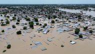 This aerial view shows houses submerged under water in Maiduguri on September 10, 2024. Photo by Audu MARTE / AFP