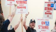 Union members react as Aerospace Machinists District 751 President Jon Holden (out of frame) announces that union members rejected a proposed Boeing contract and will go on strike, following voting results at their union hall in Seattle, Washington, on September 12, 2024. Photo by Jason Redmond / AFP
