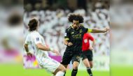 Al Sadd's Akram Afif (right) vies for the ball with an Al Ain player during yesterday's match.