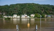 A signpost standing in the floods of the Elbe river indicates the way to the ferry in Krippen, eastern Germany on Septemer 17, 2024. (Photo by Jens Schlueter / AFP)
 