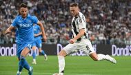 Juventus' Dutch midfielder #8 Teun Koopmeiners (R) fights for the ball with Napoli's Kosovan defender #13 Amir Rrahmani during the Italian Serie A football match Juventus vs Napoli at the Juventus Stadium in Turin on September 21, 2024. (Photo by Isabella BONOTTO / AFP)
