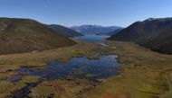 An aerial photo taken on September 12, 2024, shows the Little Prespa Lake, near the village of Buzeliqen. (Photo by Adnan Beci / AFP)
 