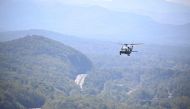 Marine One, carrying US President Joe Biden flies above a storm impacted area near Asheville, North Carolina, on October 2, 2024. (Photo by Mandel Ngan / AFP)
