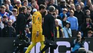 Liverpool's Brazilian goalkeeper #01 Alisson Becker leaves the game after picking up an injury during the English Premier League football match between Crystal Palace and Liverpool at Selhurst Park in south London on October 5, 2024. (Photo by Glyn KIRK / AFP)