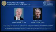 A screen shows the laureats of the 2024 Nobel Prize in Physics, US physicist John J Hopfield and Canadian-British computer scientist and cognitive psychologist Geoffrey E Hinton on October 8, 2024. (Photo by Jonathan Nackstrand / AFP)