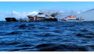 This handout photo taken and released on October 11, 2024 by the DGzRS (Deutsche Gesellschaft zur Rettung Schiffbruechiger = German Maritime Search and Rescue Service) shows smoke billowing from the German-flagged tanker ship 