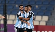 Al Wakrah’s Moayad Hassan (centre) celebrates with teammates after scoring team’s first goal. 