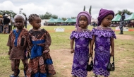 Twins pose for a photograph during the Igboora World Twins Festival 2024, in Igbo-Ora on October 12, 2024. Nigeria’s self-proclaimed ‘twins capital of the world’ Igbo-Ora holds its annual festival to celebrate the town’s unusually high incidence of multiple births. Photo by OLYMPIA DE MAISMONT / AFP.
