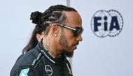 British driver Lewis Hamilton walks in the paddock ahead of the United States Formula One Grand Prix at the Circuit of the Americas in Austin, Texas, on October 17, 2024. (Photo by Patrick T. Fallon / AFP)
