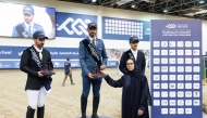 Head of the Longines Hathab Technical Support Committee Haya Al Nuaimi presents the trophies to the Small Tour podium winners.