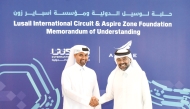 Qatar Motor & Motorcycle Federation (QMMF) and LIC President Abdulrahman bin Abdullatif Al Mannai and Deputy President and Director General of Sports Facilities Management at Aspire Zone Foundation Abdulaziz Abdullah Al Mahmoud shake hands during the MoU signing ceremony.
