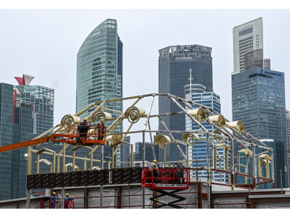 File photo for representation showing construction workers near Singapore's financial business district. AFP.
