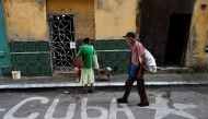 A man walks down a street in Havana on October 22, 2024. (Photo by Yamil Lage / AFP)
