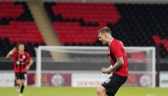 Al Rayyan's Roger Guedes celebrates after scoring his second goal against Al Ahli.