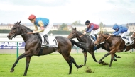 Christophe Soumillon steers Map Of Stars (left) towards the title at Chantilly yesterday.  