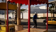 A man runs along the corniche in Dakar on October 29, 2024. (Photo by JOHN WESSELS / AFP)
