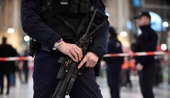 File photo for representational purposes only. A policeman holds a 40-millimetre rubber defensive bullet launcher LBD (LBD40) to Paris' Gare du Nord train station, after several people were lightly wounded by a man wielding a knife on January 11, 2023. (Photo by Julien De Rosa / AFP)


