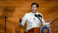 Philippine President Ferdinand Marcos delivers the annual State of the Nation Address at the House of Representatives in Manila on July 22, 2024. (Photo by JAM STA ROSA / AFP)
