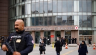 A security member stands guard in front of the Bakirkoy courthouse, on the opening day of Turkey's newborn gang trafficking case trial, in Istanbul, on November 18, 2024. (Photo by KEMAL ASLAN / AFP)

