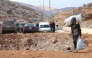 Lebanese man fleeing Israeli airstrikes. AFP file photo.