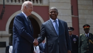 US President Joe Biden (L) shakes hands with Angola President Joao Lourenco (R) ahead of their bilateral meeting at the Presidential Palace in Luanda on December 3, 2024. (Photo by ANDREW CABALLERO-REYNOLDS / AFP)
