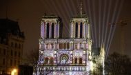 This photograph shows video mapping on the facade of Notre-Dame de Paris cathedral a few days before its reopening after reconstruction following the fire on April 15, 2019 when it was devastated, in Paris on December 5, 2024. Photo by Ludovic MARIN / AFP.