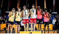 Beach Pro Tour Finals 2024 Doha champions Anders Mol and Christian Sorum, runners up David Ahman and Jonatan Hellvig of Sweden (left) and bronze winners Cherif Younousse and Ahmed Tijan (right) of Qatar celebrate on the podium. RIGHT: Kristen Nuss and Taryn Kloth won the women’s title.