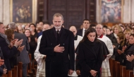 King Felipe VI of Spain (left) and his wife Queen Letizia arrive to attend a funeral mass held on December 9, 2024 at the Cathedral of Valencia in memory of the victims of the deadly floods that devastaded the region in late October. (Photo by Kai Fosterling / POOL / AFP)