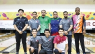 Qatar’s Talal Al Marri (front right) poses for a photo along with other participants.   