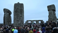 Revellers celebrate the pagan festival of 'Winter Solstice' at Stonehenge in Wiltshire in southern England on December 21, 2024. (Photo by JUSTIN TALLIS / AFP)
