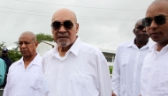 (FILES) Suriname former President Desi Bouterse (C) leaves the High Court of Justice after his appeal case against the Court Martial sentence of 20-year jail for his involvement in the murder of 15 people when he ruled in 1982 during his military government, in Paramaribo on January 5, 2023. (Photo by Ranu Abhelakh / AFP)
